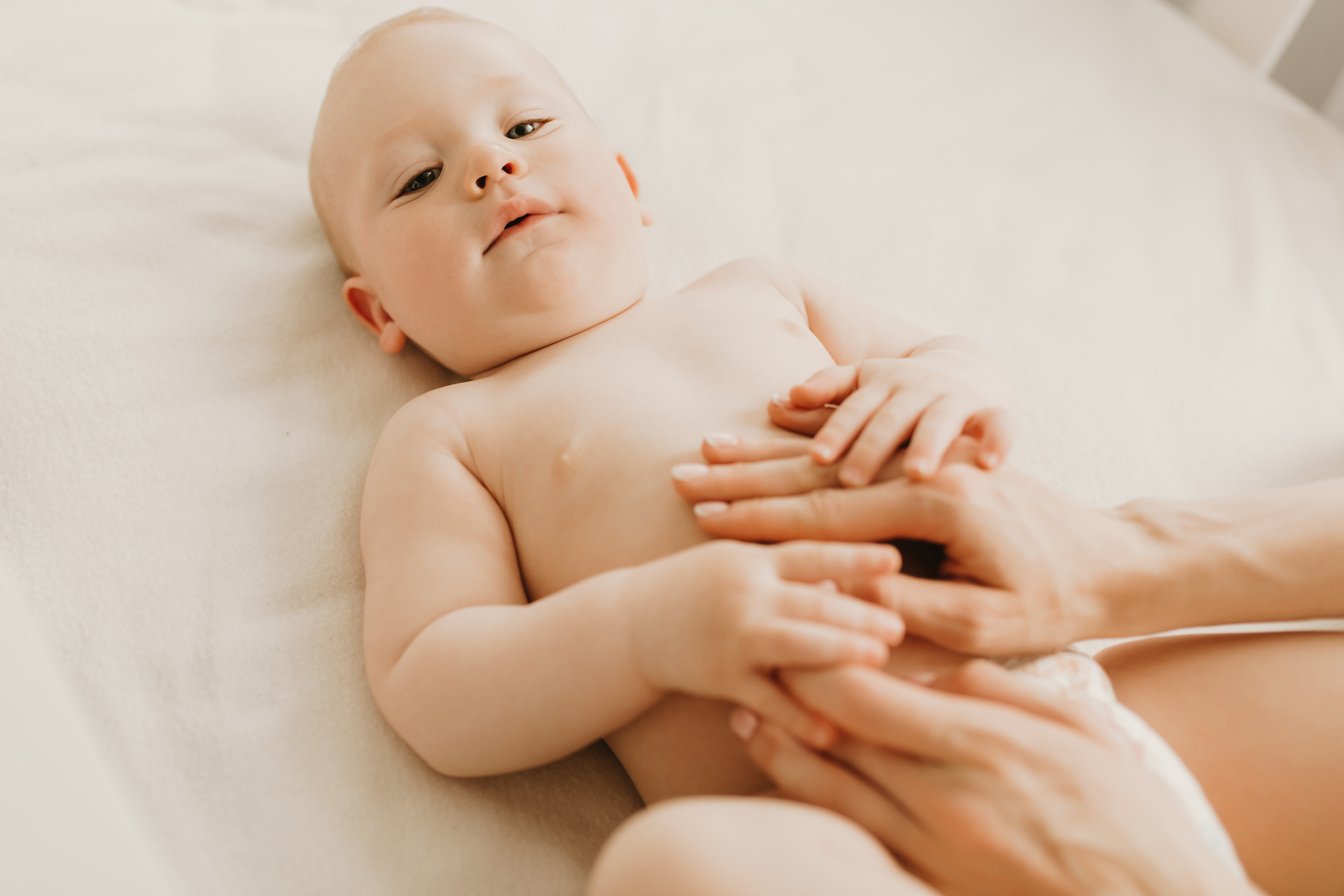 Baby Massage, Mom Massages the Baby's Belly during Colic